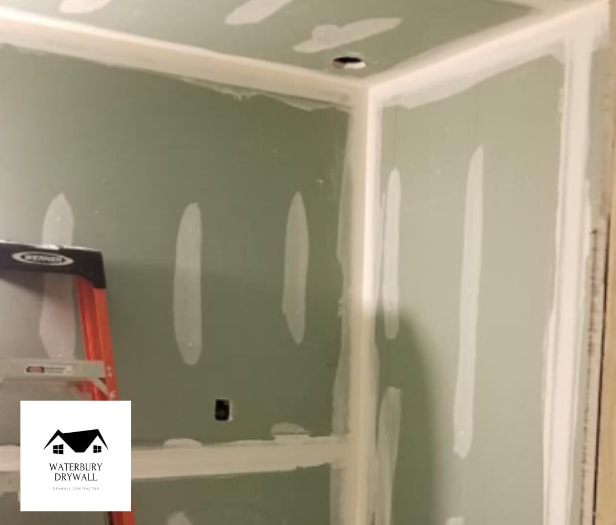 this is a picture of drywall being repaired by waterbury drywall