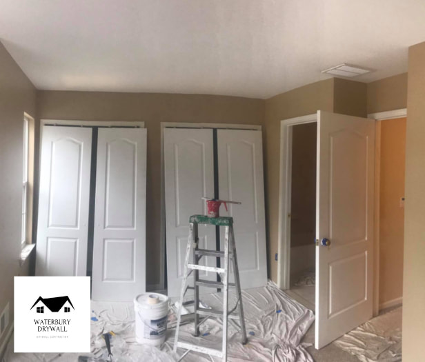 this is a picture of waterbury drywall painting a room
